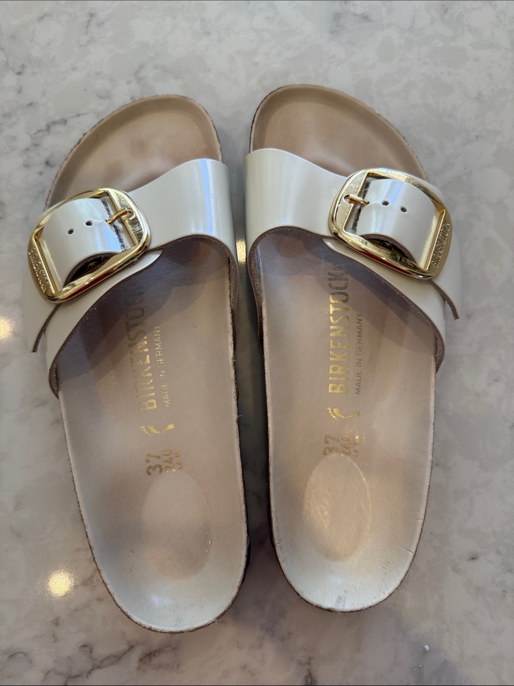 Birkenstock White Patent Single-Strap Slides with Gold Buckle